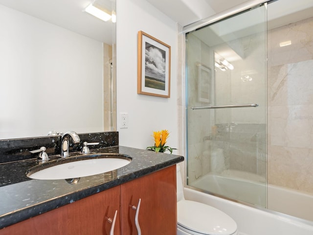 534 Beach Rd, Sarasota, FL 34242 - bathroom with toilet, vanity, and shower / bath combination with glass door