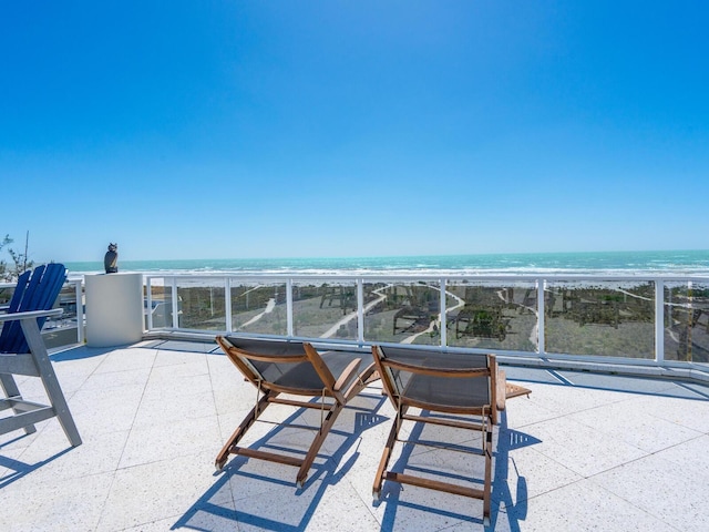 534 Beach Rd, Sarasota, FL 34242 - view of patio / terrace with a beach view and a water view