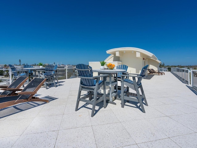 534 Beach Rd, Sarasota, FL 34242 - view of patio / terrace featuring outdoor dining area, boat lift, and a boat dock