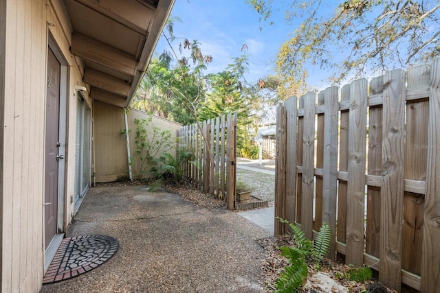 view of patio featuring fence