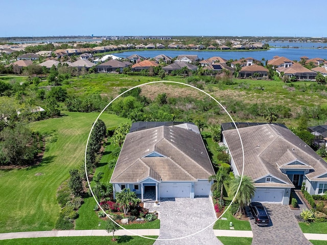 aerial view featuring a residential view and a water view