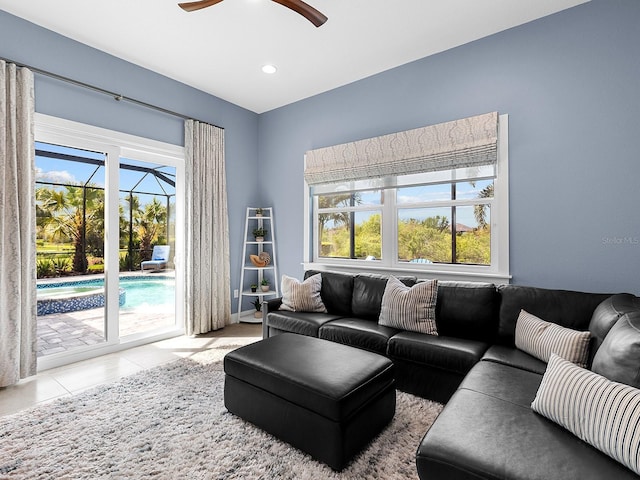 living room featuring a wealth of natural light, recessed lighting, a ceiling fan, and light tile patterned flooring