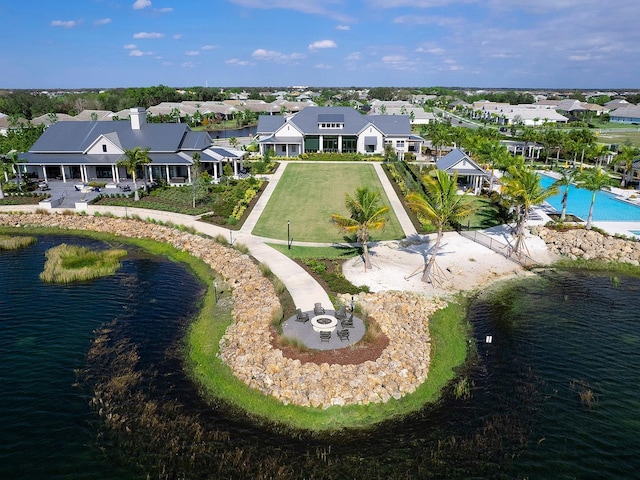 bird's eye view featuring a residential view and a water view