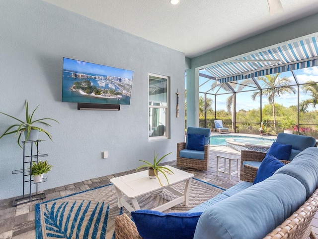 view of patio with outdoor lounge area, a lanai, an outdoor pool, and an in ground hot tub