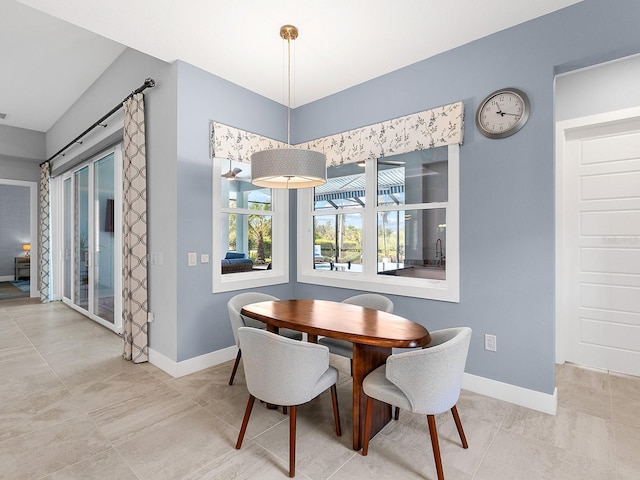 dining space featuring baseboards