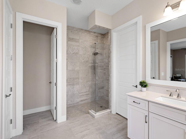 813 Tailwind Pl, Sarasota, FL 34240 - full bath with a stall shower, vanity, baseboards, and tile patterned flooring