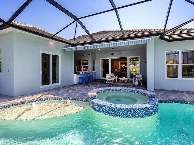 813 Tailwind Pl, Sarasota, FL 34240 - view of pool featuring a ceiling fan, a pool with connected hot tub, a patio, and glass enclosure