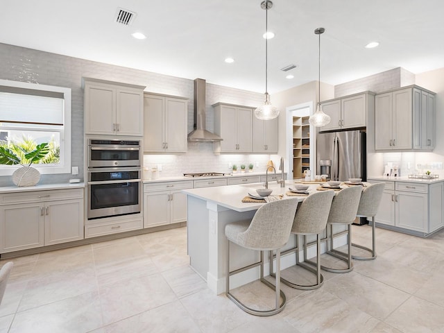 813 Tailwind Pl, Sarasota, FL 34240 - kitchen featuring wall chimney exhaust hood, stainless steel appliances, gray cabinetry, and recessed lighting