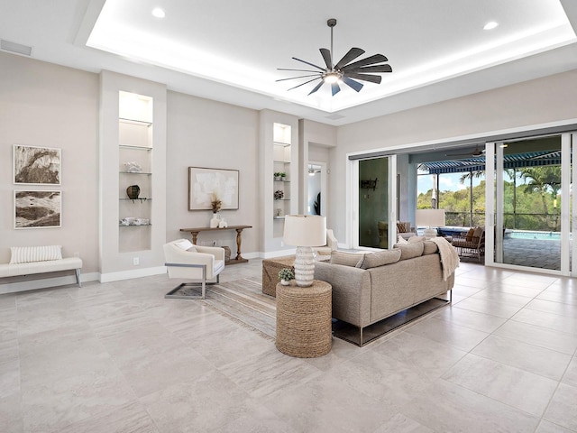 813 Tailwind Pl, Sarasota, FL 34240 - living area with a tray ceiling, built in shelves, a ceiling fan, recessed lighting, and baseboards