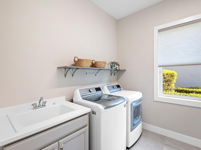 813 Tailwind Pl, Sarasota, FL 34240 - laundry room featuring washing machine and clothes dryer, cabinet space, and baseboards