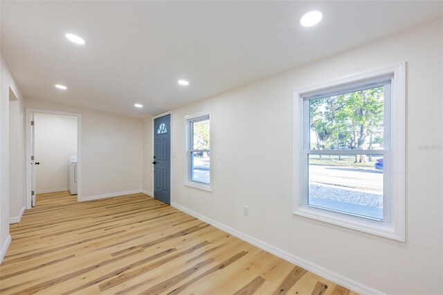 foyer entrance with recessed lighting, baseboards, washer / clothes dryer, and light wood-style floors