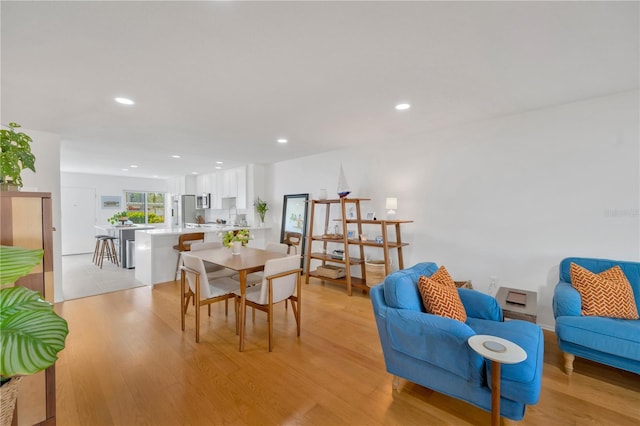 dining room featuring recessed lighting and light wood-style floors