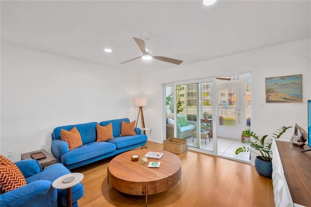 living area featuring ceiling fan, wood finished floors, and recessed lighting