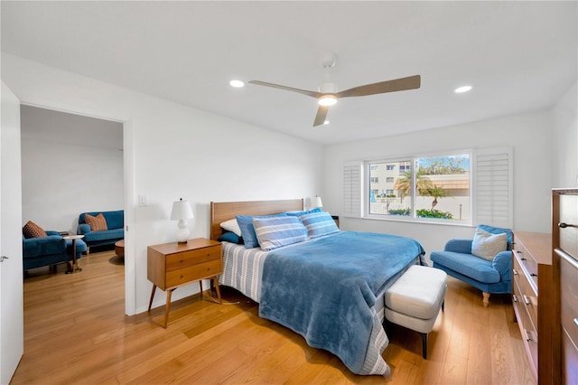 bedroom featuring light wood-style flooring, a ceiling fan, and recessed lighting