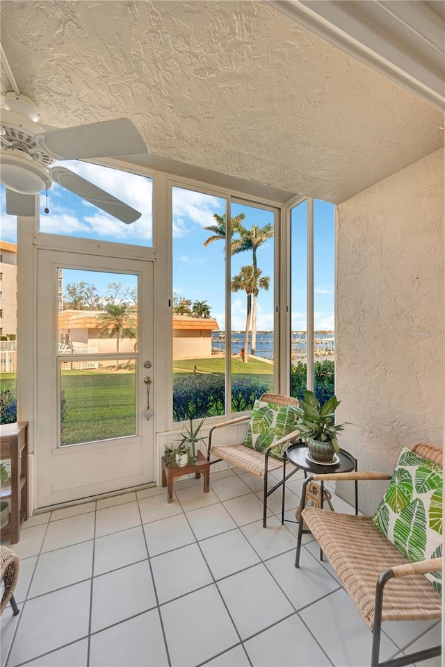 sunroom / solarium with ceiling fan