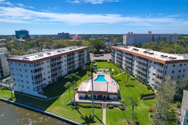 birds eye view of property featuring a water view and a city view