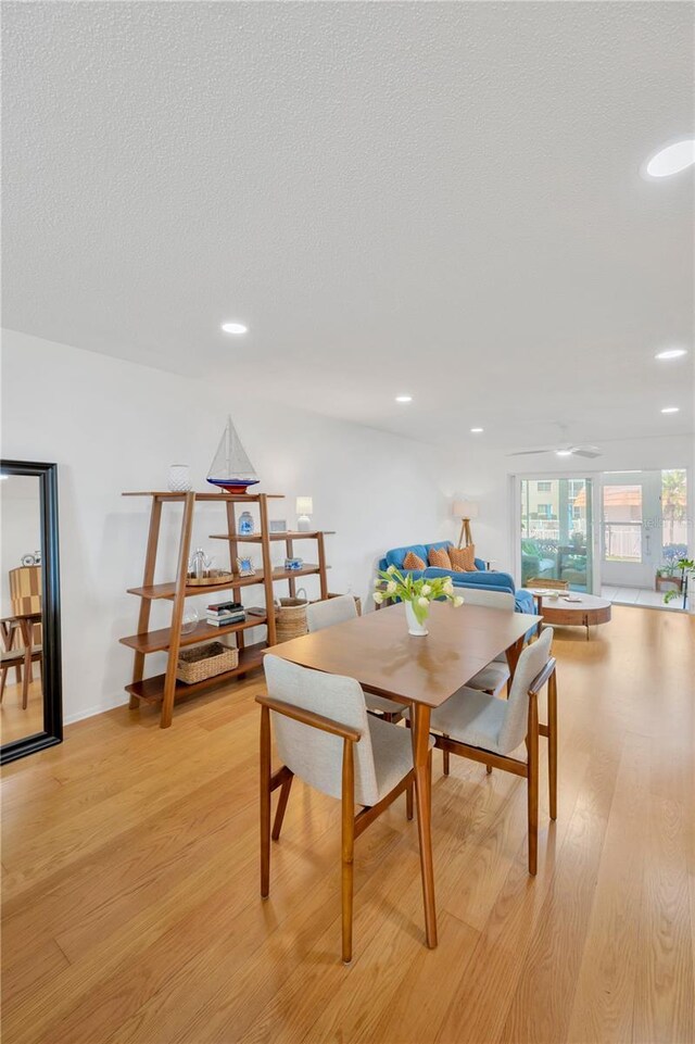 1600 1st Ave W Unit 102A, Bradenton, FL 34205 - dining space featuring light wood finished floors, recessed lighting, and a textured ceiling