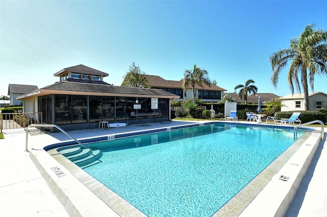 pool featuring a patio and fence