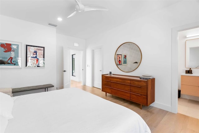 bedroom featuring light wood-style floors, recessed lighting, visible vents, and baseboards