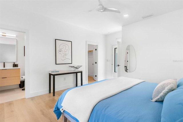 bedroom with visible vents, baseboards, a ceiling fan, connected bathroom, and light wood-style flooring