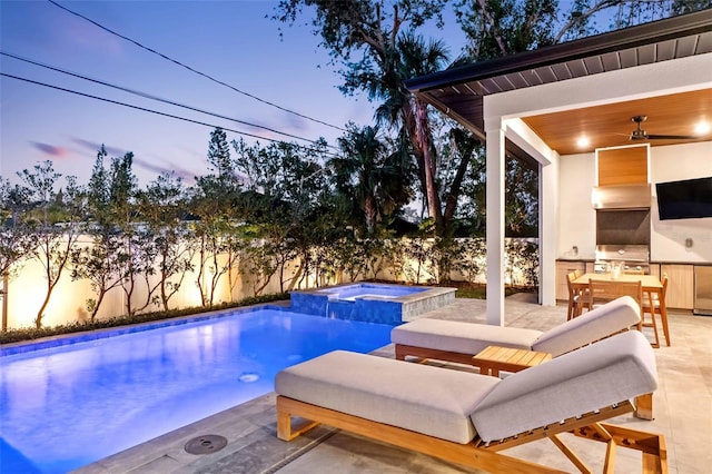 pool at dusk featuring a patio area, ceiling fan, a fenced backyard, and area for grilling