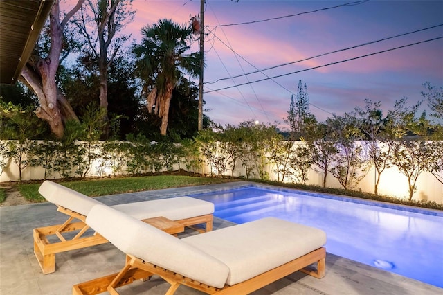 view of pool featuring a fenced backyard and a patio