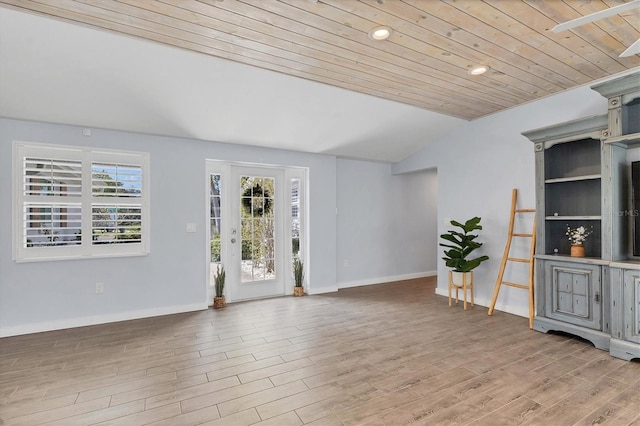 entrance foyer featuring wooden ceiling, vaulted ceiling, baseboards, and wood finished floors