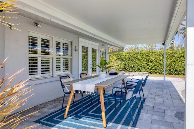 view of patio with french doors and outdoor dining space