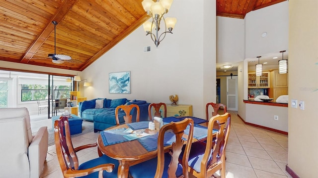 dining room with a barn door, light tile patterned floors, visible vents, and wooden ceiling