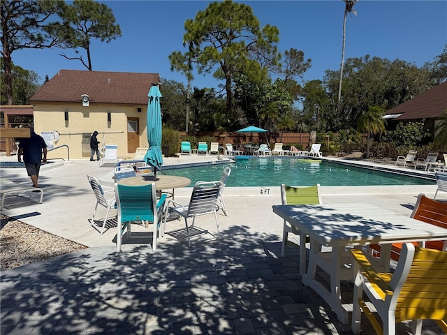 pool featuring a patio and fence