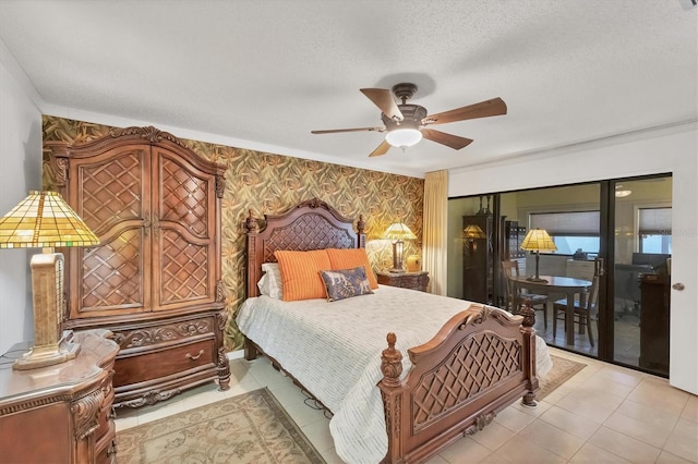 bedroom with ceiling fan, a textured ceiling, wallpapered walls, light tile patterned floors, and access to exterior