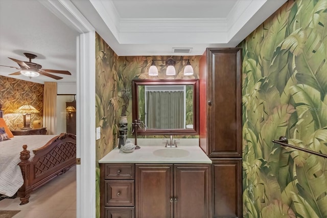 ensuite bathroom featuring visible vents, wallpapered walls, ornamental molding, ensuite bath, and a raised ceiling