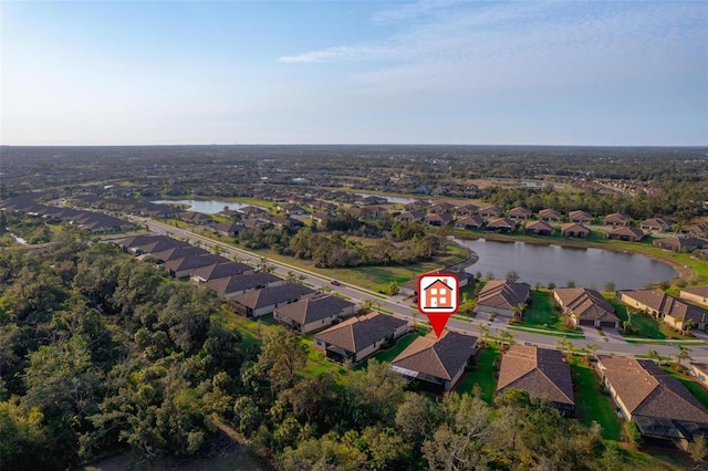 bird's eye view with a water view and a residential view