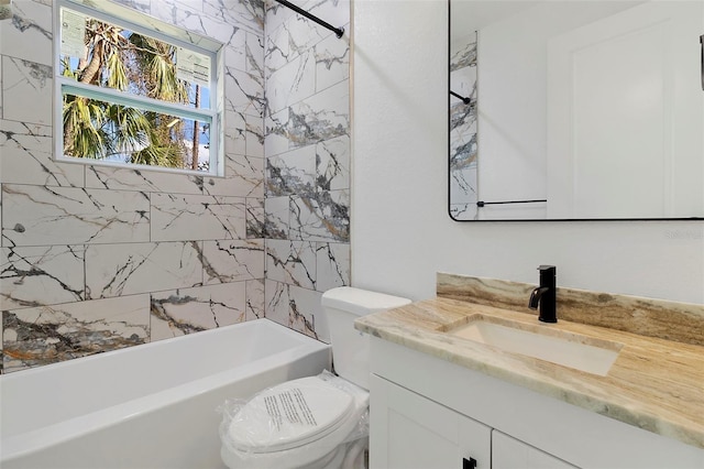 full bathroom featuring toilet, tub / shower combination, and vanity