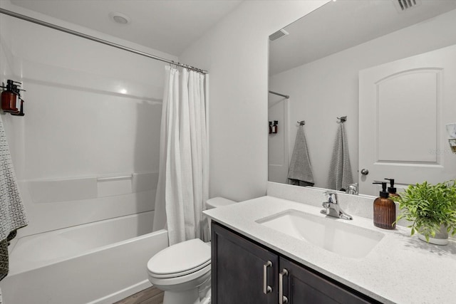 full bath featuring toilet, shower / tub combo, visible vents, and vanity