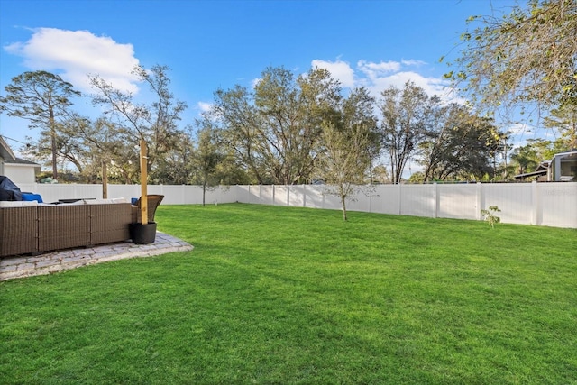 view of yard with an outdoor hangout area and a fenced backyard