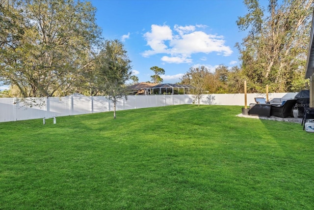 view of yard with a fenced backyard