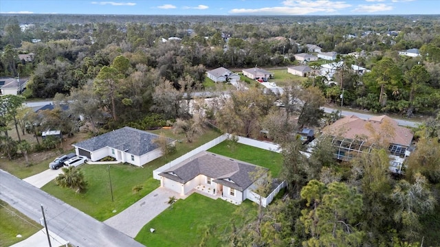 drone / aerial view featuring a view of trees