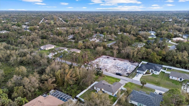 aerial view featuring a residential view and a view of trees