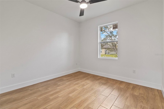 unfurnished room with light wood-style floors, ceiling fan, and baseboards