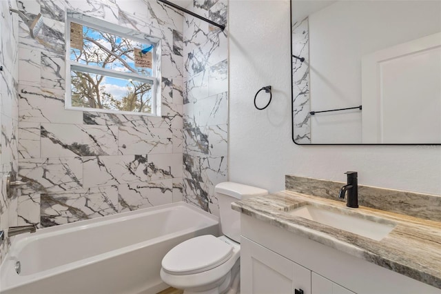 bathroom featuring toilet, a textured wall, bathing tub / shower combination, and vanity