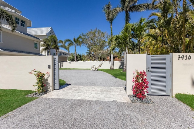 view of gate with a patio area and fence