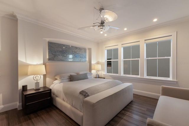 bedroom featuring baseboards, dark wood-style flooring, and crown molding