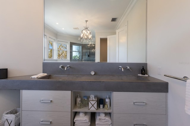 full bathroom featuring visible vents, vanity, a chandelier, and crown molding