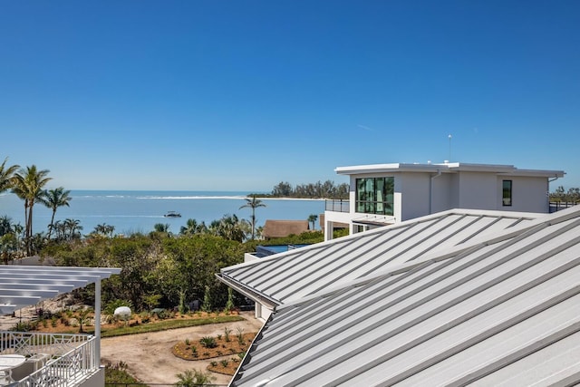 view of side of home featuring a water view