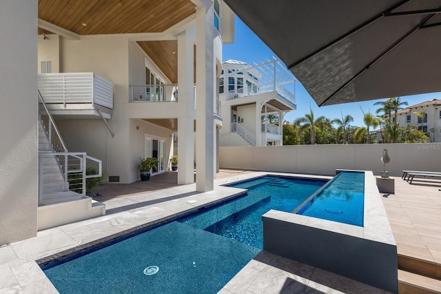 view of swimming pool with stairs, a patio, fence, and a fenced in pool