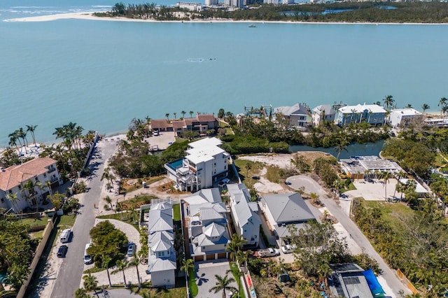 drone / aerial view with a residential view and a water view