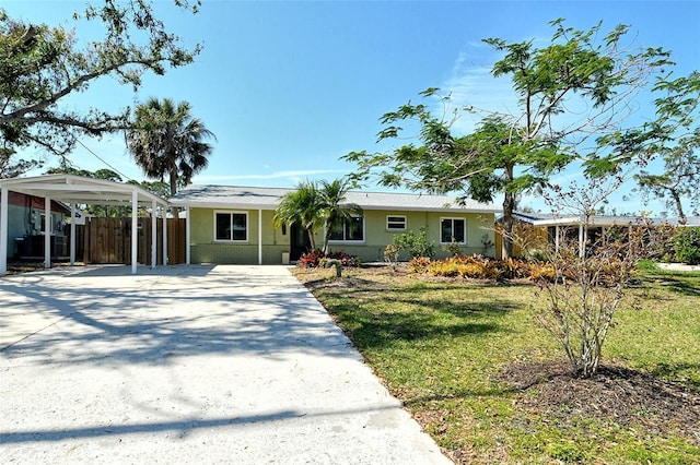 single story home featuring driveway, a front lawn, and fence