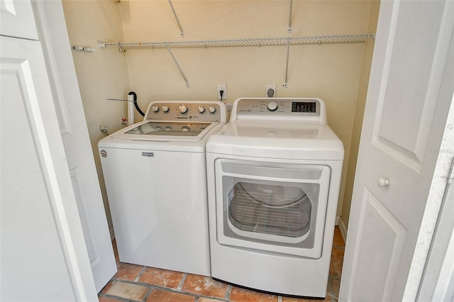 washroom with laundry area and washing machine and clothes dryer