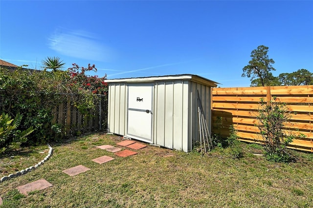 view of shed with a fenced backyard